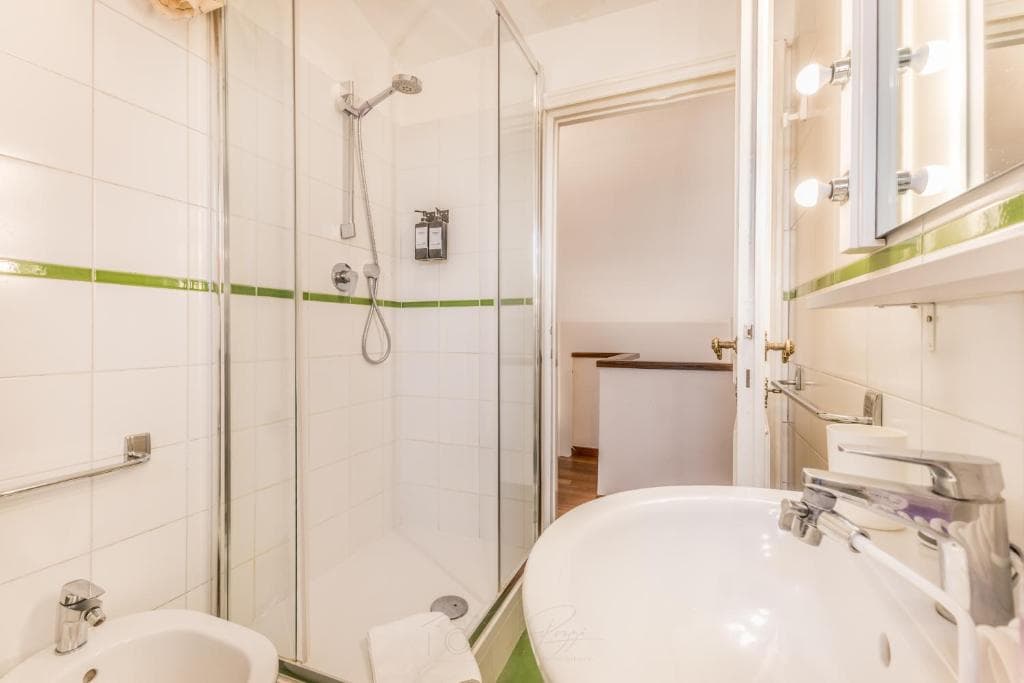 Bathroom with walk-in glass shower and washbasin