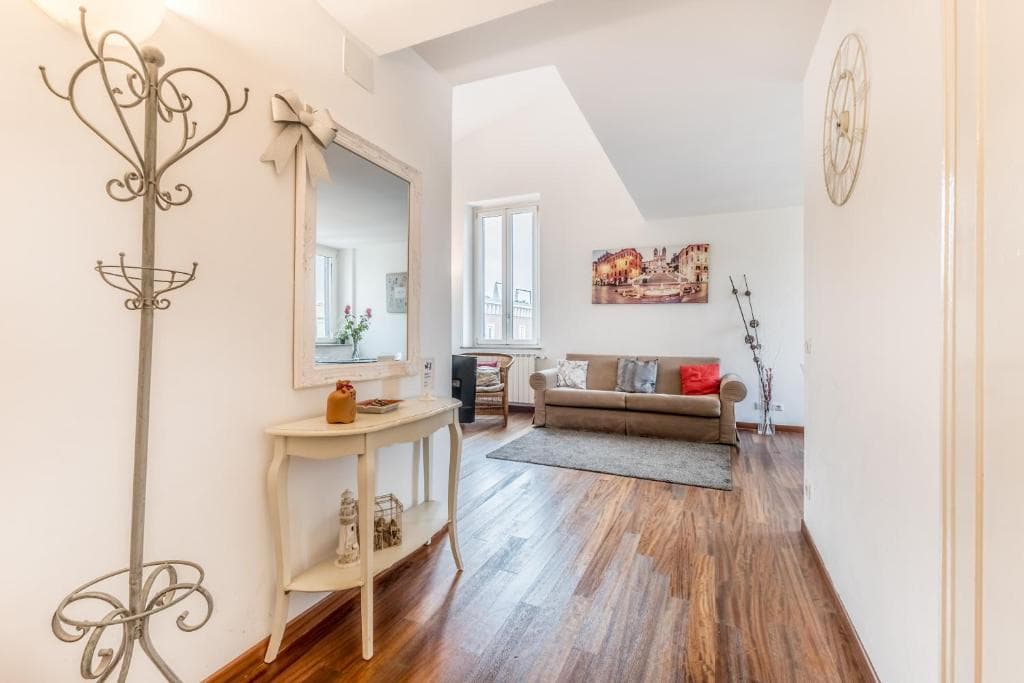 Entrance opening onto the living room, with mirror and console