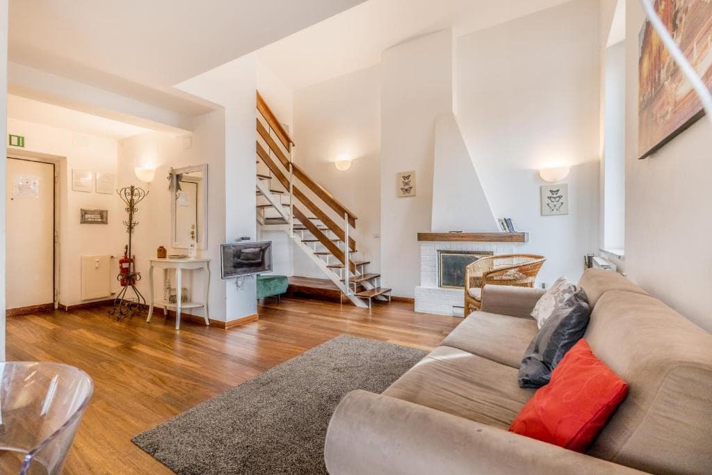 Open-plan living and dining area with staircase to the mezzanine